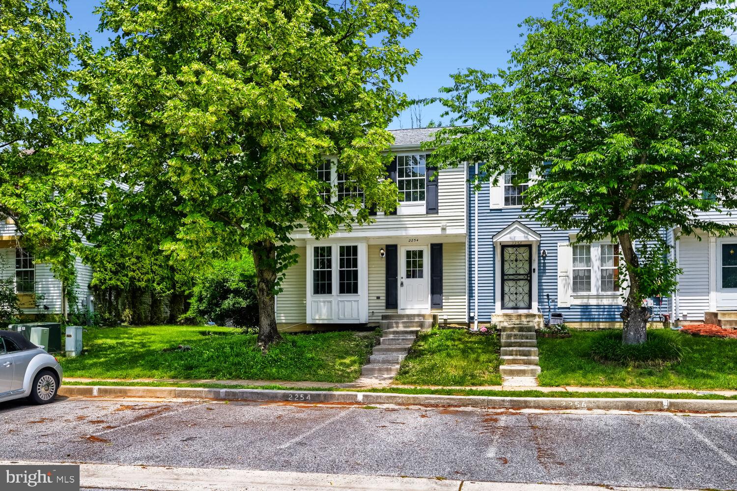 Charming duplex with lush greenery.