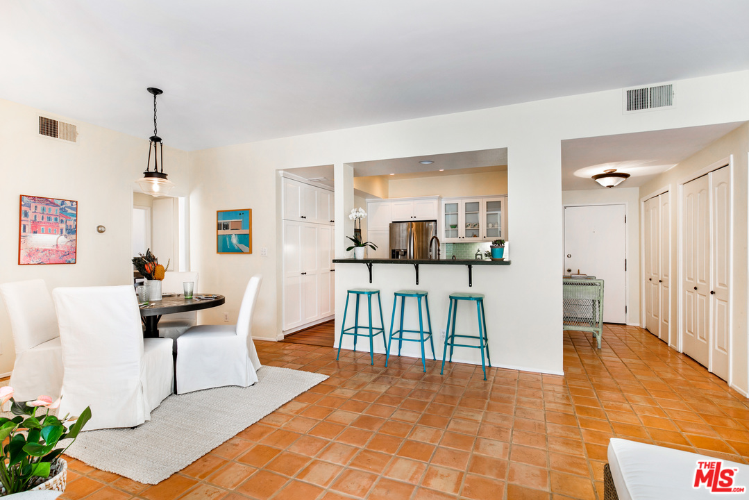 8180 Manitoba Street, Unit 124 Playa del Rey, CA 90293 - Photo 1 of 30 a dining room with furniture and a view of kitchen