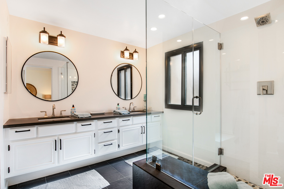 8180 Manitoba Street, Unit 124 Playa del Rey, CA 90293 - Photo 14 of 30 a bathroom with 2 sink tub and a mirror