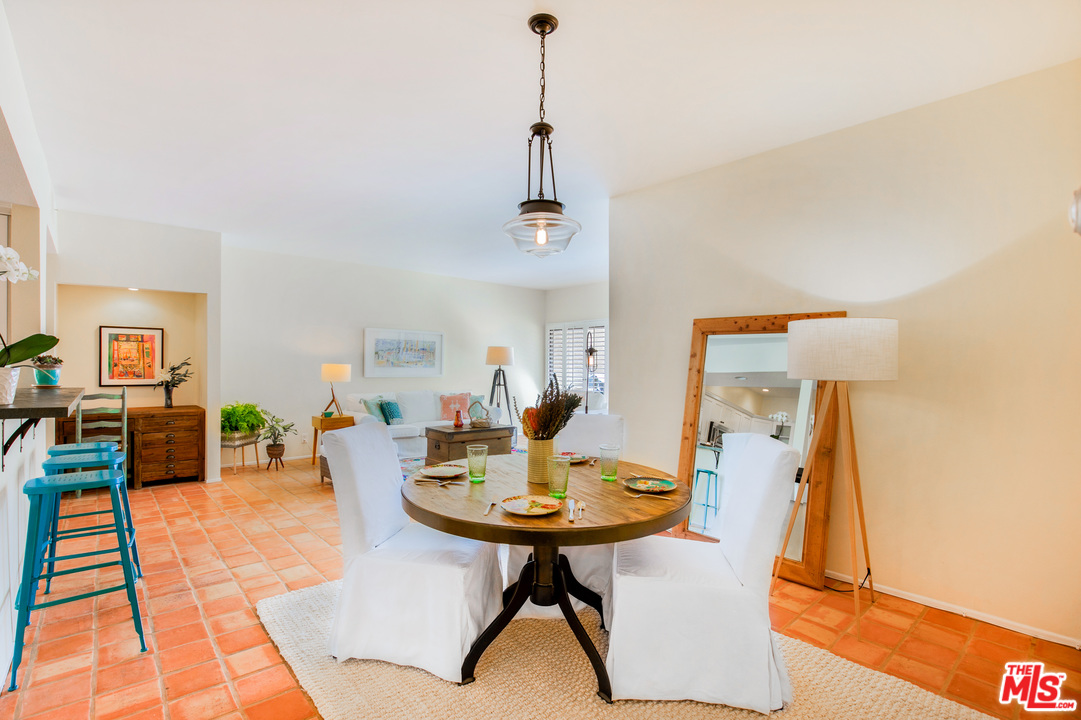 8180 Manitoba Street, Unit 124 Playa del Rey, CA 90293 - Photo 17 of 30 a dining room with a table and chairs