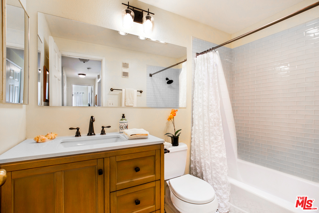 8180 Manitoba Street, Unit 124 Playa del Rey, CA 90293 - Photo 19 of 30 a bathroom with a sink a toilet and shower