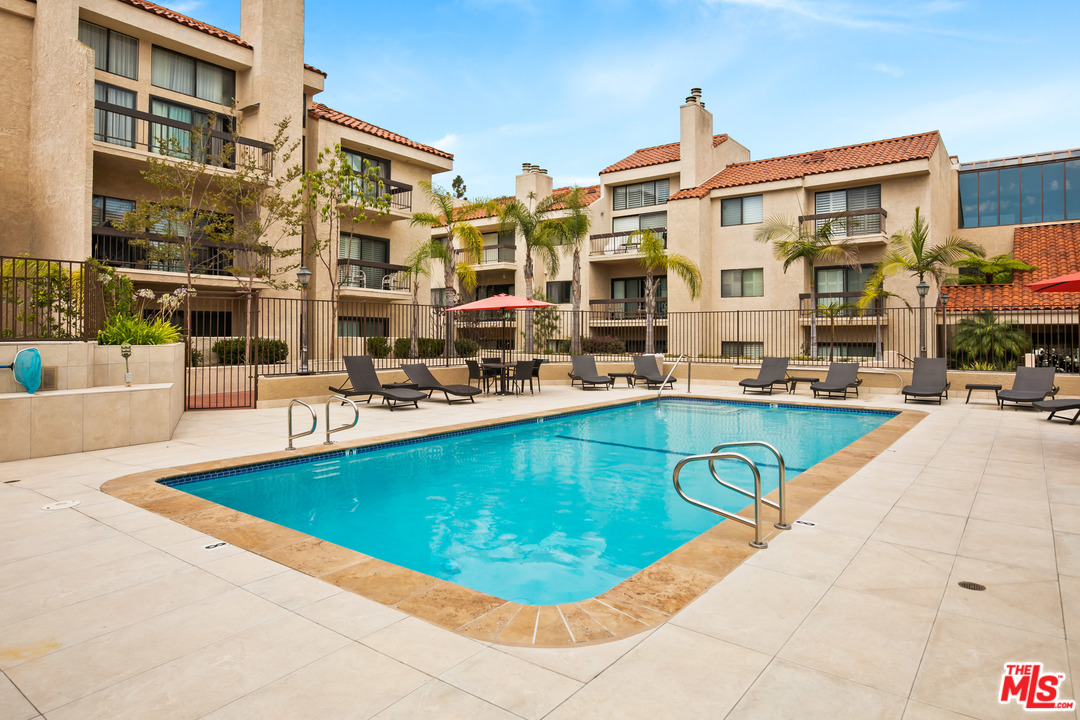 8180 Manitoba Street, Unit 124 Playa del Rey, CA 90293 - Photo 29 of 30 a view of a swimming pool with a lounge chairs