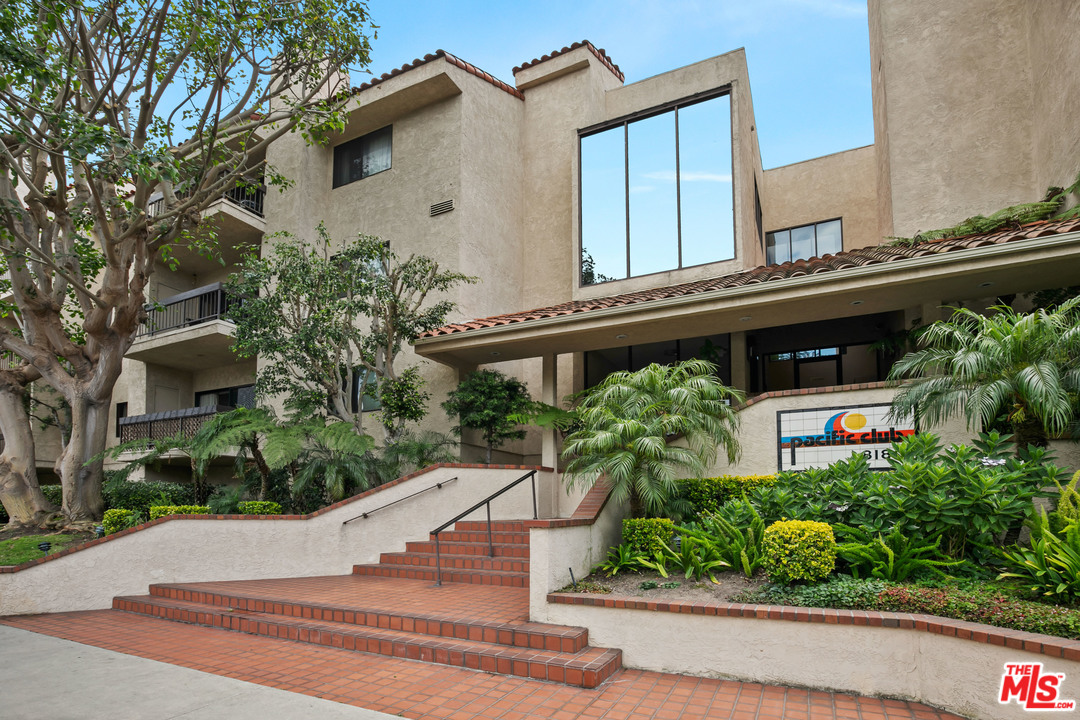 8180 Manitoba Street, Unit 124 Playa del Rey, CA 90293 - Photo 6 of 30 front view of a building with potted plants