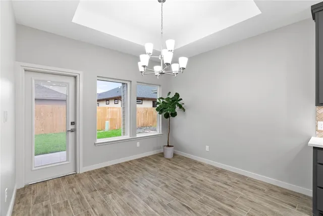 a kitchen with a stove a refrigerator and wooden cabinets