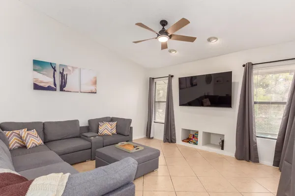 a living room with furniture and a fireplace