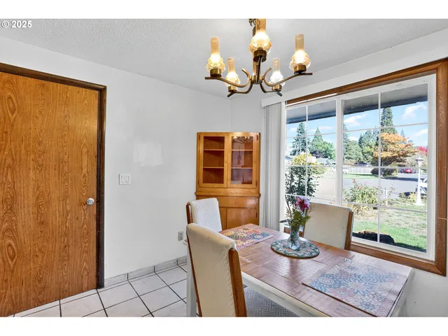 a dining room filled window with furniture