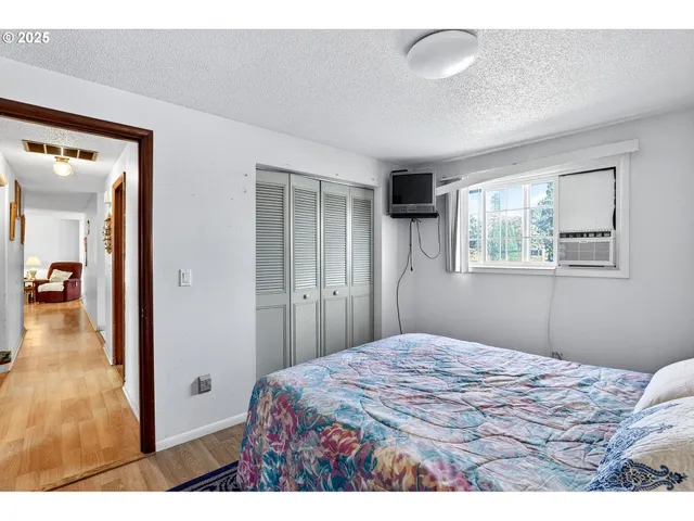 a bedroom with a bed and a view of bathroom