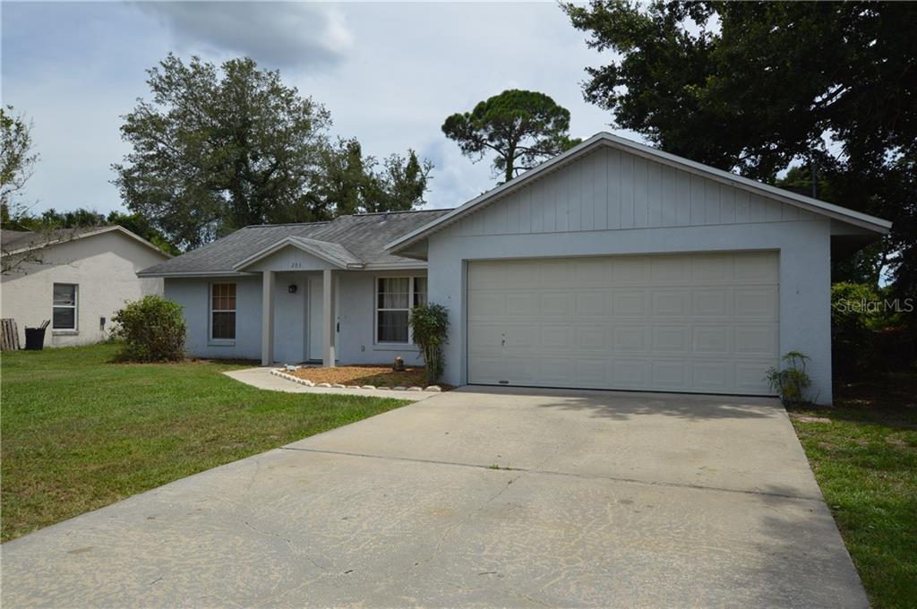 203 Verona Road DeBary, FL 32713 - Photo 1 of 1 a front view of a house with garden