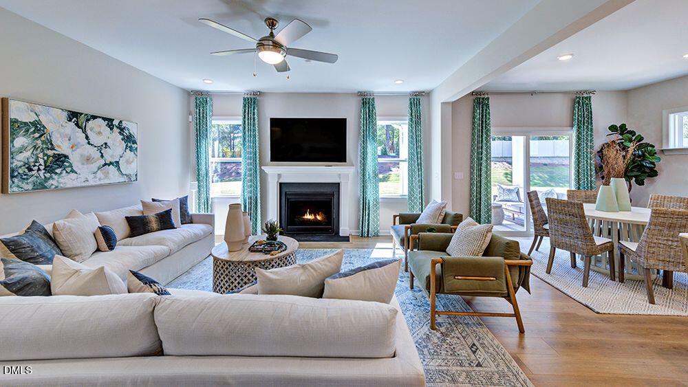 151 Rivulet Court Cary, NC 27519 - Photo 13 of 37 a living room with furniture fireplace and a flat screen tv