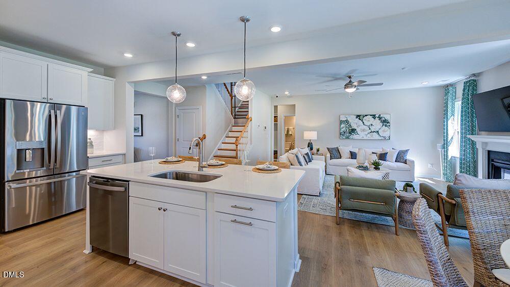 151 Rivulet Court Cary, NC 27519 - Photo 20 of 37 a kitchen with a sink stove and refrigerator