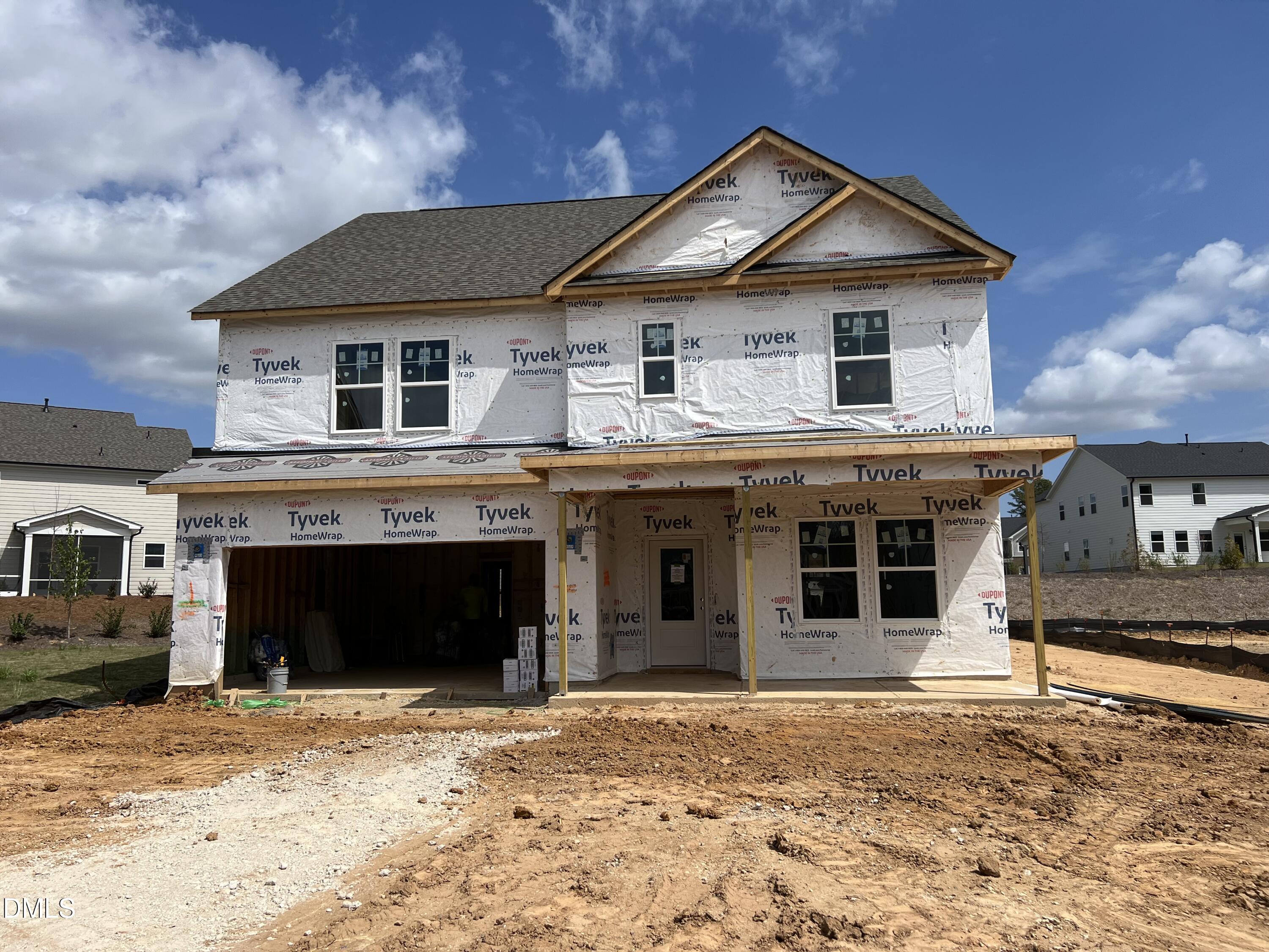 151 Rivulet Court Cary, NC 27519 - Photo 2 of 37 a front view of a house with a yard and garage
