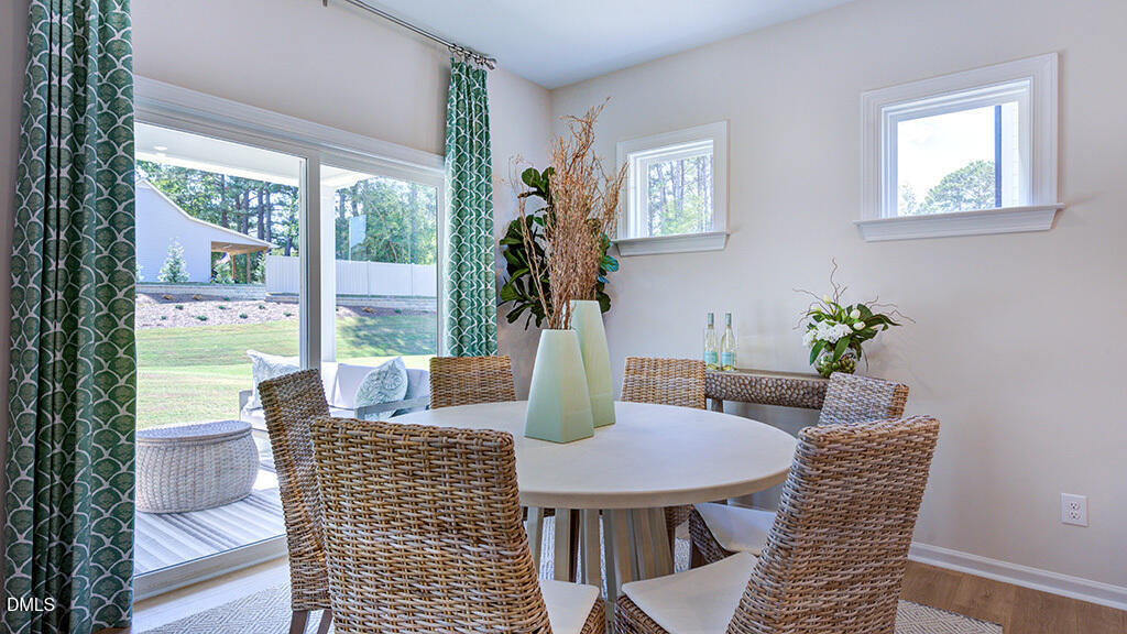151 Rivulet Court Cary, NC 27519 - Photo 22 of 37 a view of a dining room with furniture window and outside view