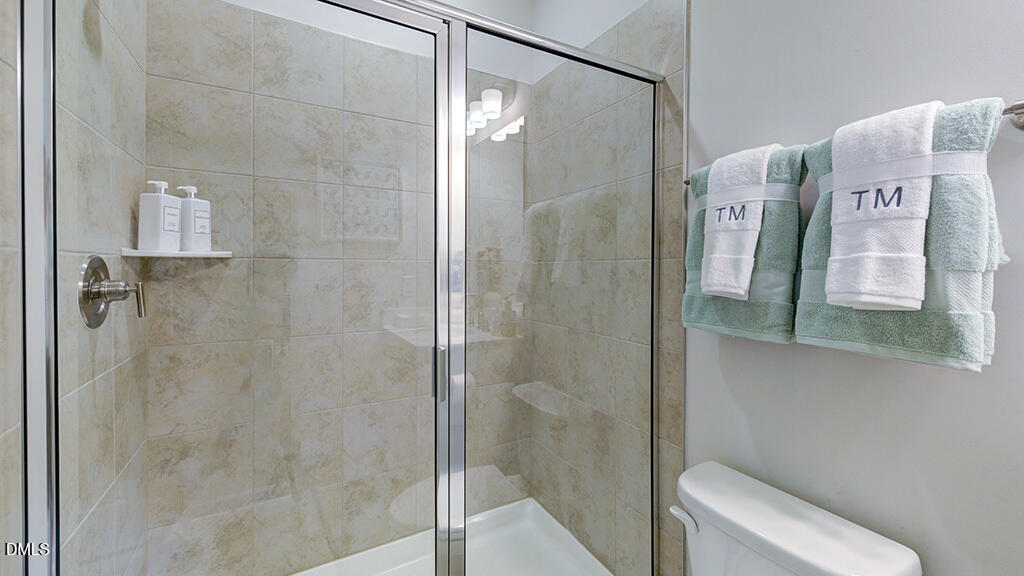 151 Rivulet Court Cary, NC 27519 - Photo 24 of 37 a bathroom with a shower and toilet