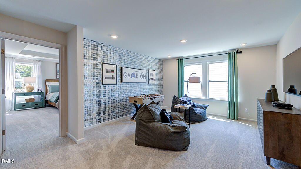 151 Rivulet Court Cary, NC 27519 - Photo 25 of 37 a living room with furniture and a flat screen tv