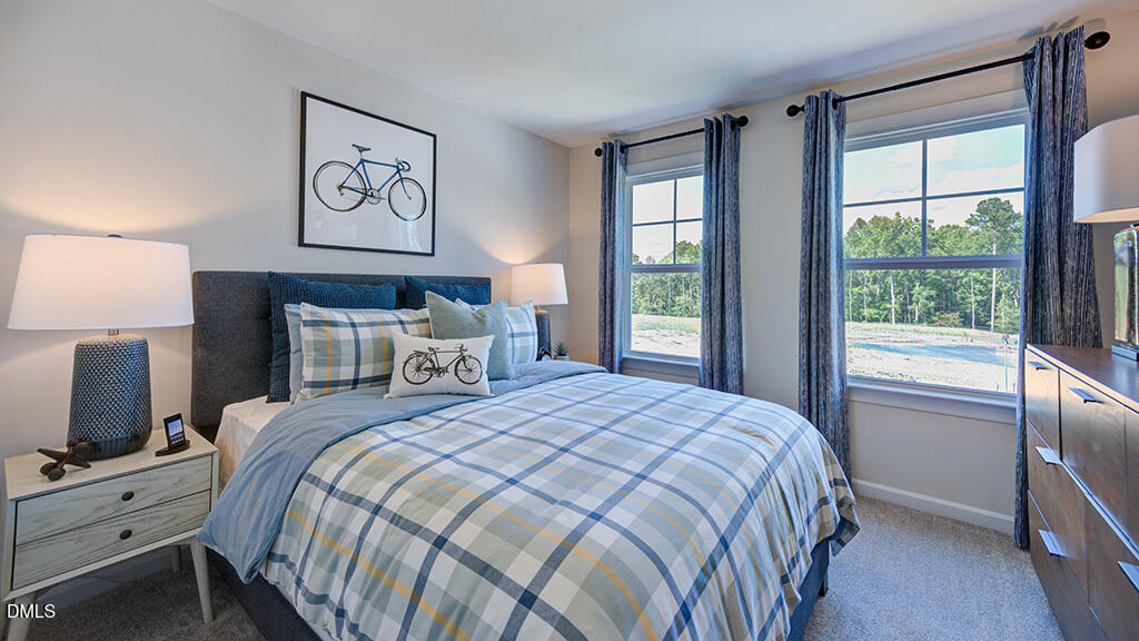 151 Rivulet Court Cary, NC 27519 - Photo 31 of 37 a bedroom with a bed and a window