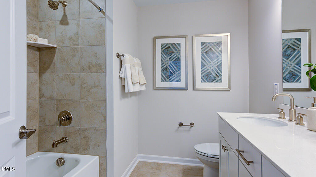151 Rivulet Court Cary, NC 27519 - Photo 32 of 37 a bathroom with a sink a toilet and shower