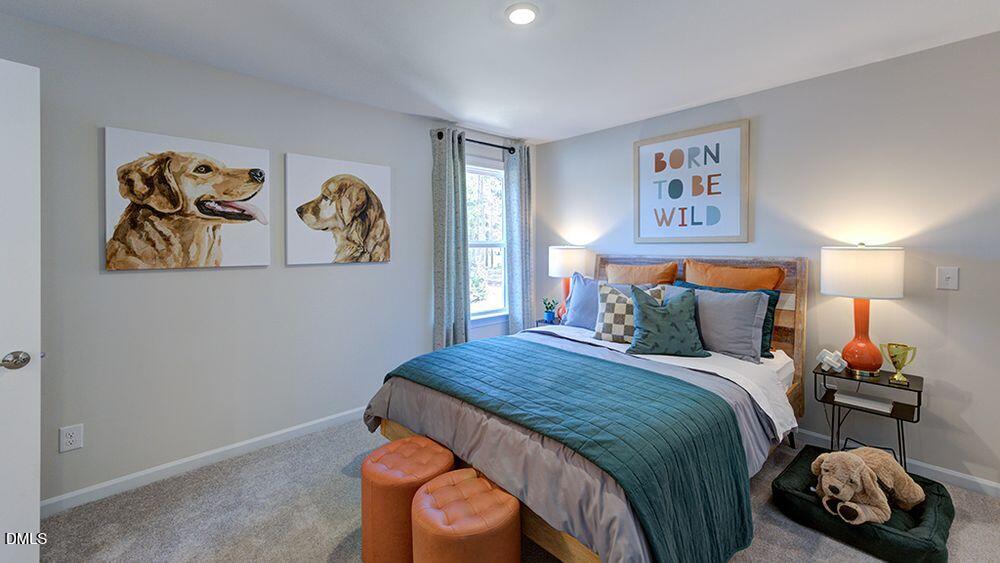 151 Rivulet Court Cary, NC 27519 - Photo 33 of 37 a bedroom with a bed and painting on the wall