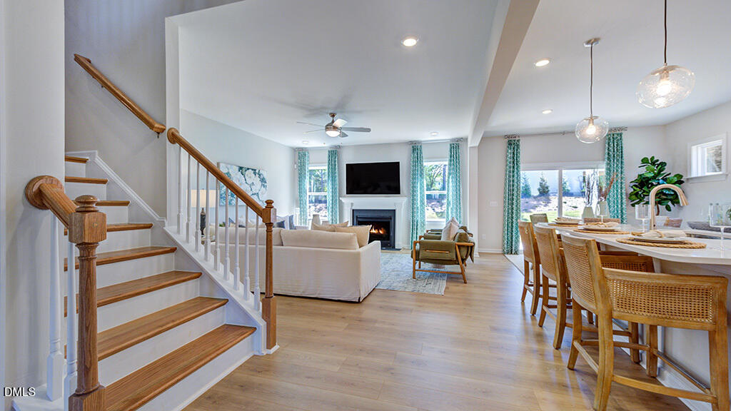 151 Rivulet Court Cary, NC 27519 - Photo 10 of 37 a view of a dining room with furniture wooden floor and chandelier