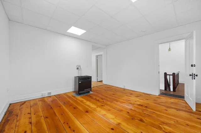 a bedroom with a bed and a table