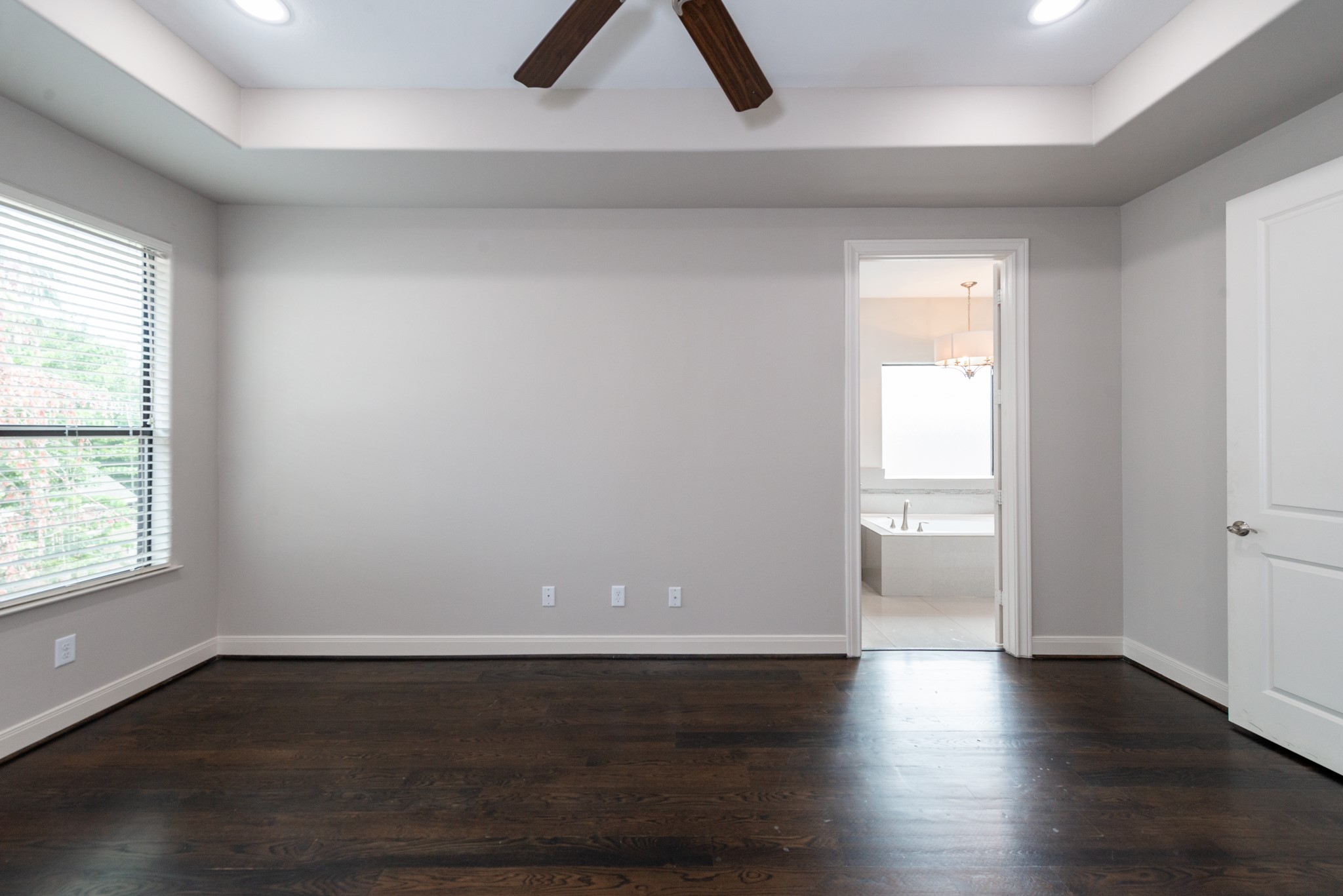 3504 Chenevert Street, Unit A Houston, TX 77004 - Photo 15 of 33 an empty room with wooden floor and window
