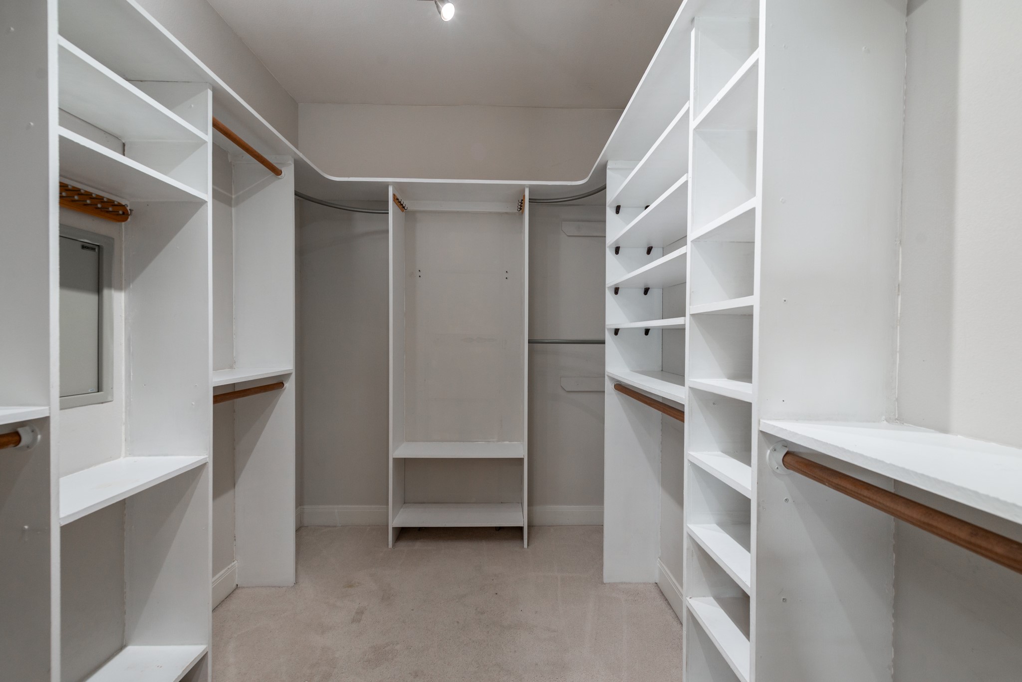 3504 Chenevert Street, Unit A Houston, TX 77004 - Photo 18 of 33 a view of walk in closet with empty racks