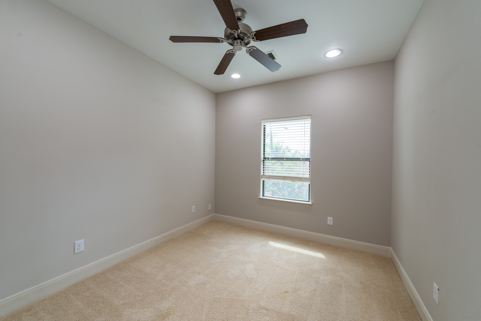3504 Chenevert Street, Unit A Houston, TX 77004 - Photo 25 of 33 an empty room with a window and a fan