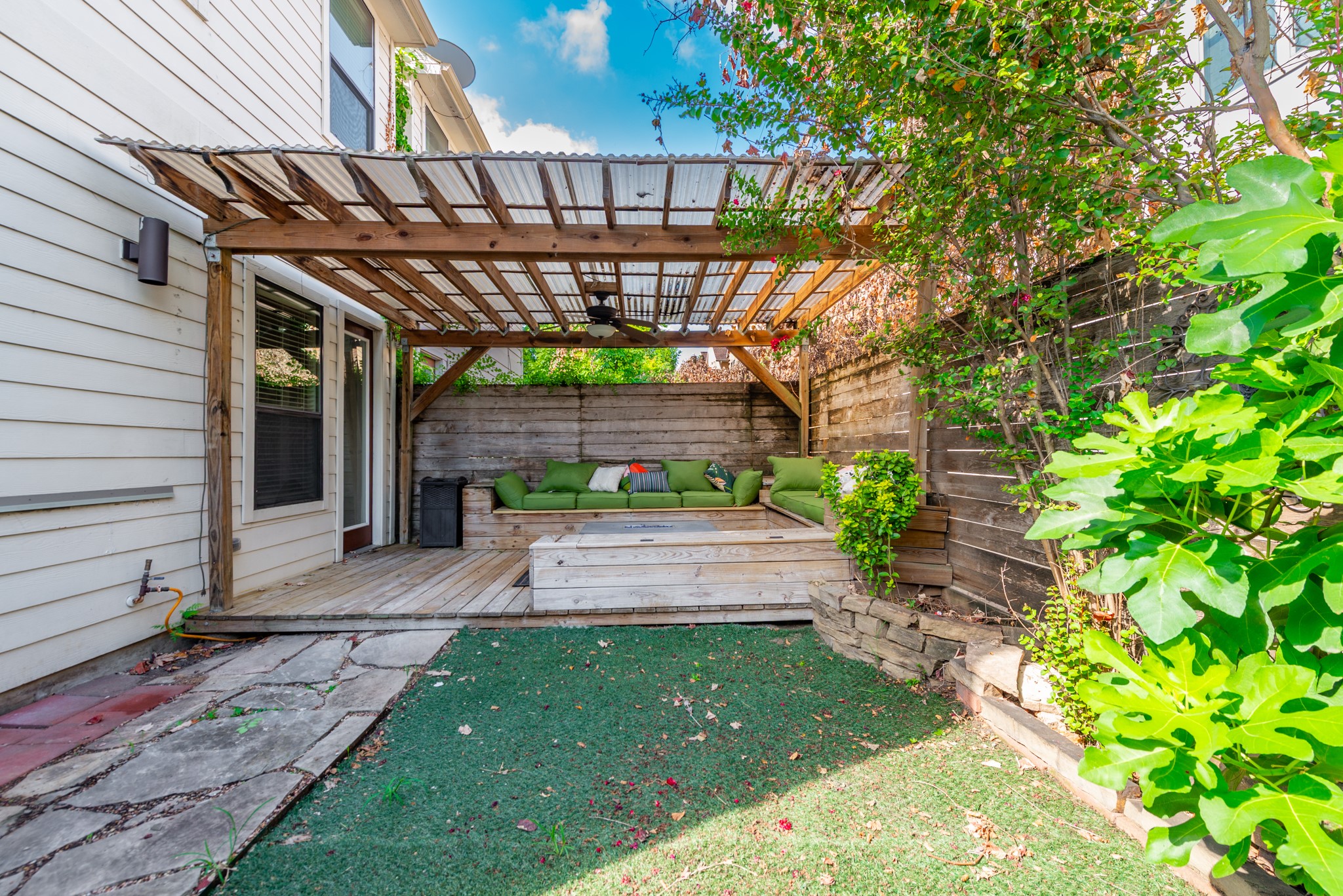 3504 Chenevert Street, Unit A Houston, TX 77004 - Photo 31 of 33 a view of a patio with table and chairs with wooden floor and plants