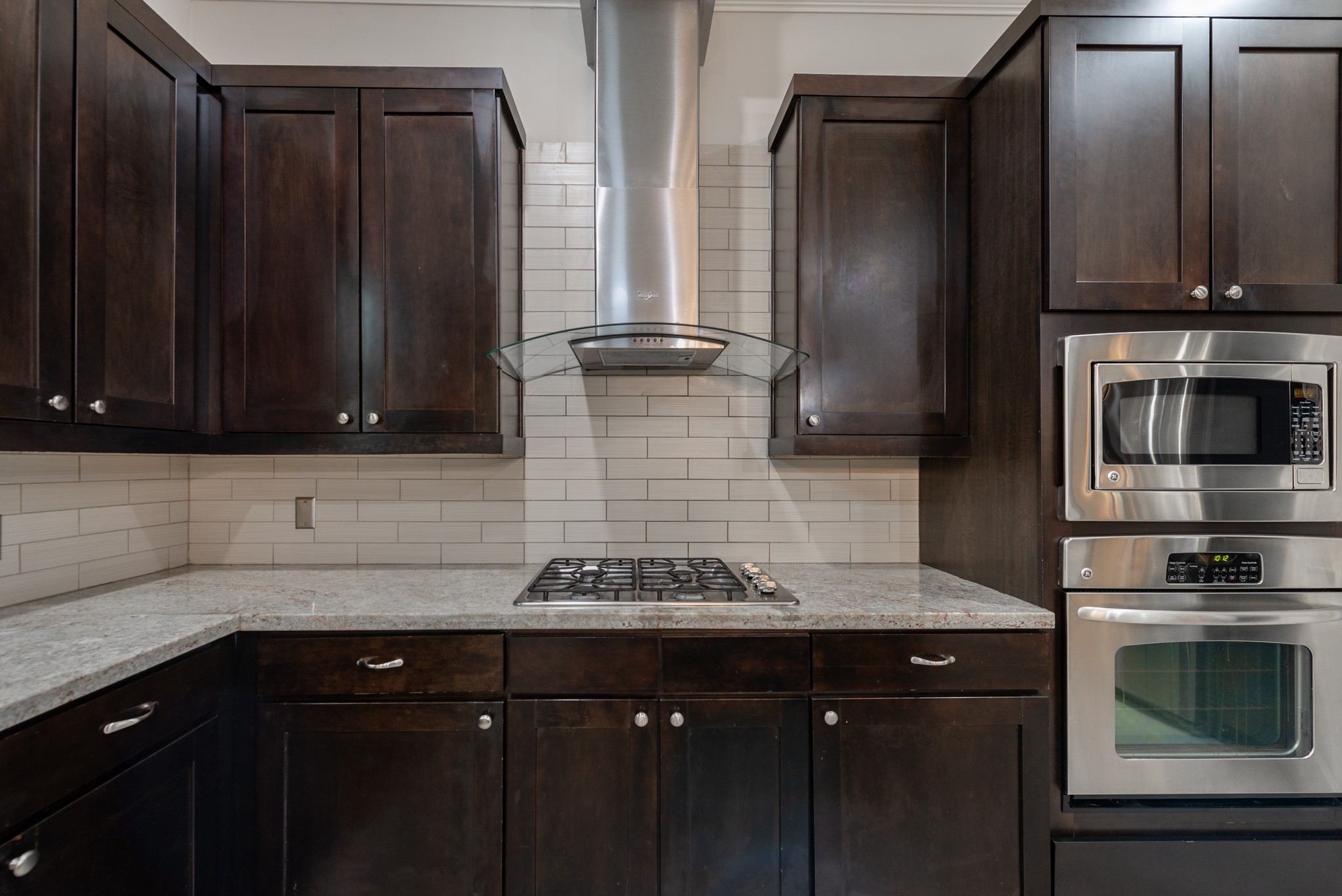 3504 Chenevert Street, Unit A Houston, TX 77004 - Photo 8 of 33 a kitchen with stainless steel appliances granite countertop a sink stove and refrigerator