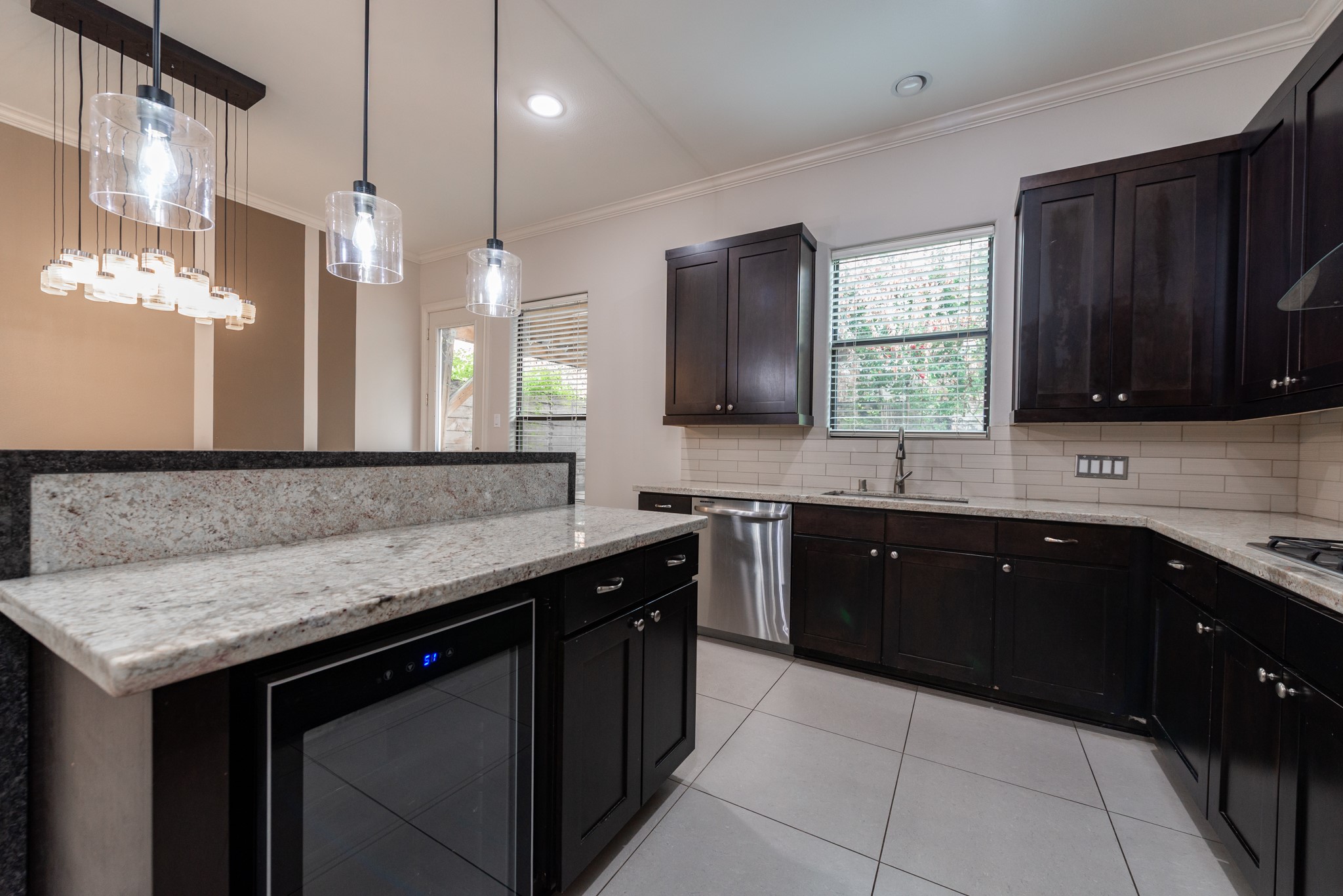 3504 Chenevert Street, Unit A Houston, TX 77004 - Photo 9 of 33 a kitchen with a sink a counter space appliances and cabinets