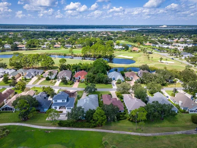 a view of a city with lots of residential buildings and mountain view in back