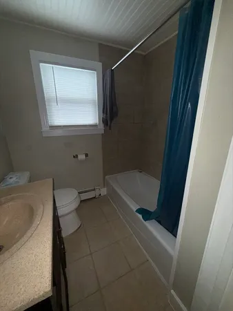 a bathroom with a tub and a sink