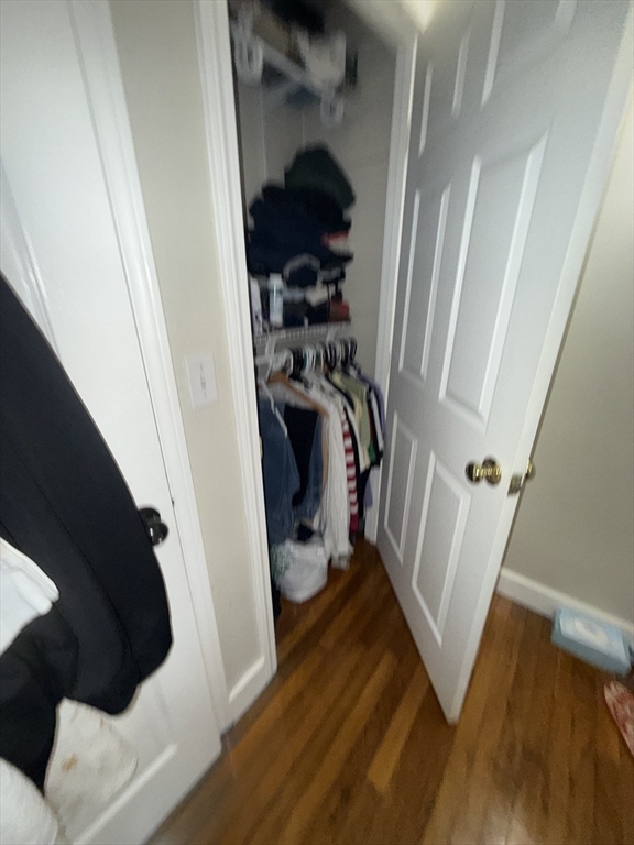38 Ballard Street, Unit 2 Saugus, MA 01906 - Photo 16 of 17 a view of walk in closet with clothes and shoes