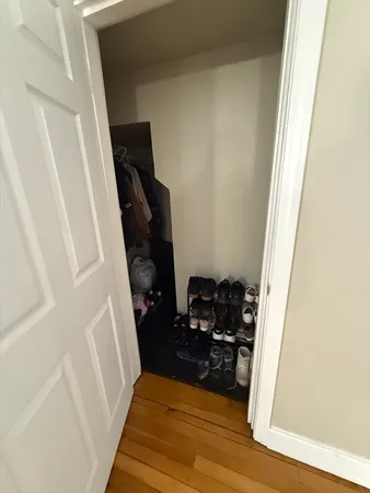a view of walk in closet with clothes