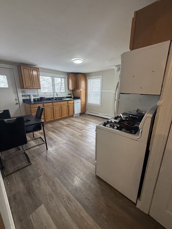 38 Ballard Street, Unit 2 Saugus, MA 01906 - Photo 8 of 17 a living room with furniture and a wooden floor