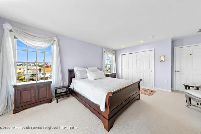 a view of a house with swimming pool and sitting area