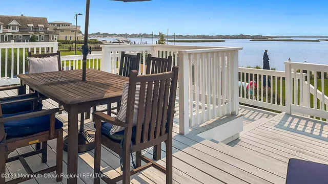 a view of a chair and table in the garden