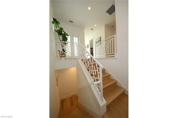 a view of a hallway with staircase