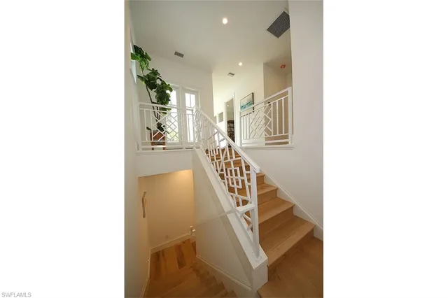 a view of a hallway with staircase