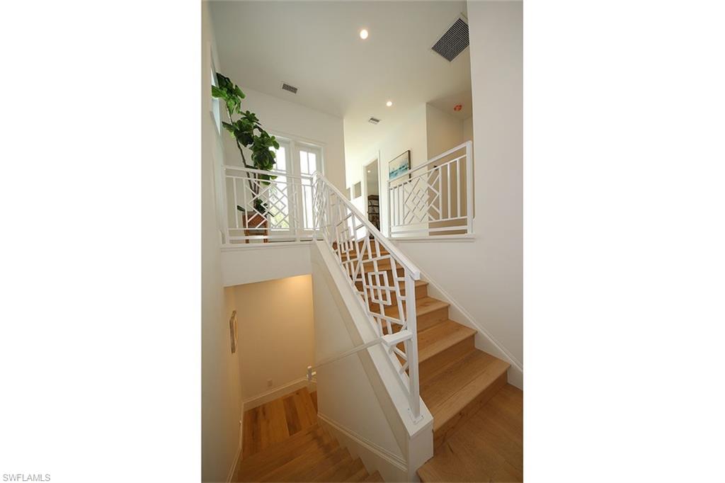 300 2nd Avenue North Naples, FL 34102 - Photo 29 of 41 a view of a hallway with staircase