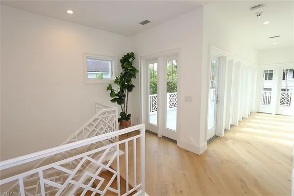 a view of an entryway with wooden floor