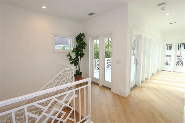 a view of an entryway with wooden floor