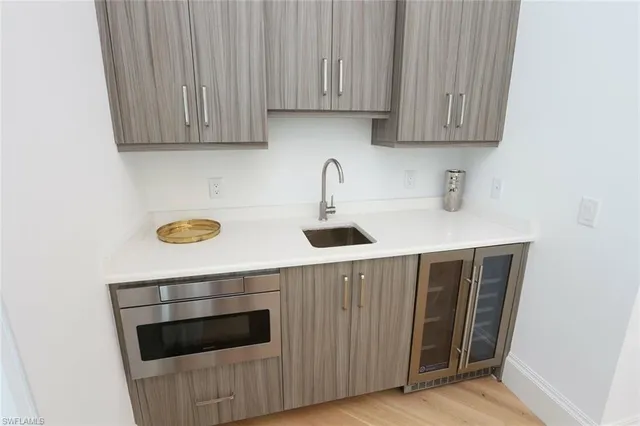 a kitchen with a sink and cabinets