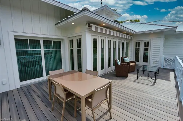 a view of a patio with a table and chairs