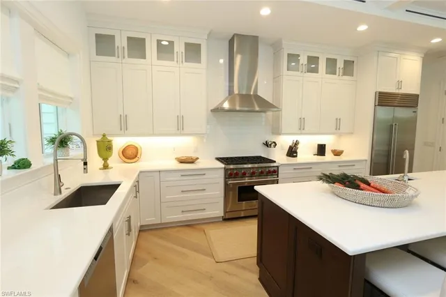 a kitchen with a sink stove and refrigerator