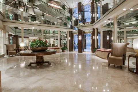 a view of a building with sitting area