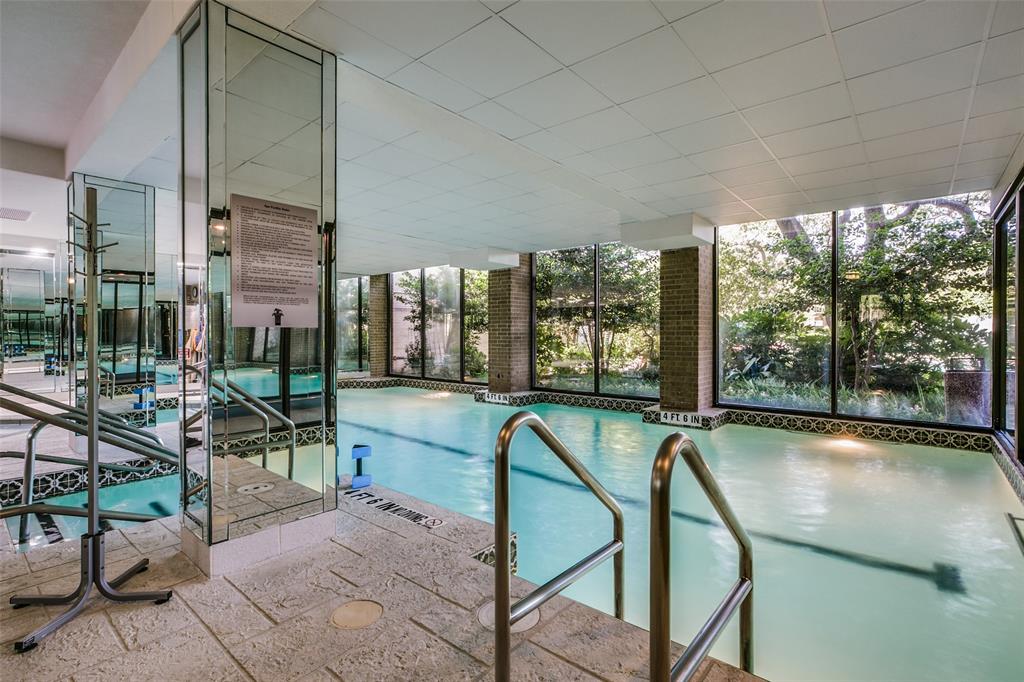 5200 Keller Springs Road, Unit 824 Dallas, TX 75248 - Photo 16 of 26 a view of a patio with a table chairs and a floor to ceiling window