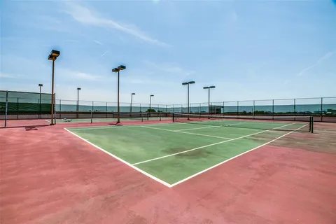 a view of a lake with a yard and lake view