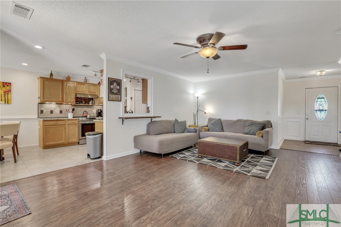 156 Burton Road Savannah, GA 31405 - Photo 6 of 28 Living room opens up into kitchen