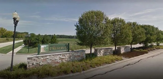 a view of a park with large trees