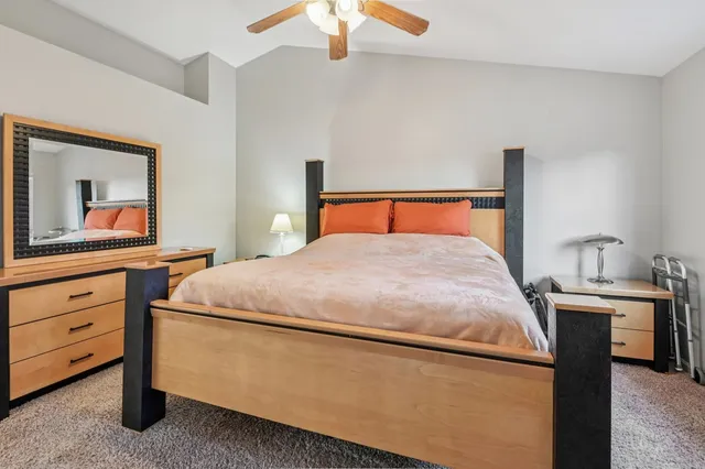 a bedroom with a bed and a dresser